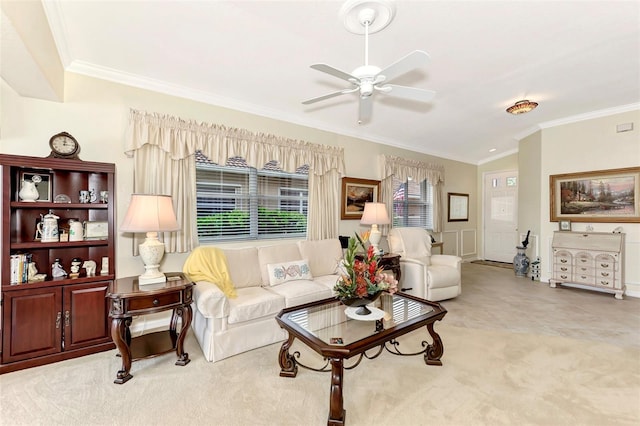 carpeted living room with vaulted ceiling, ceiling fan, and crown molding