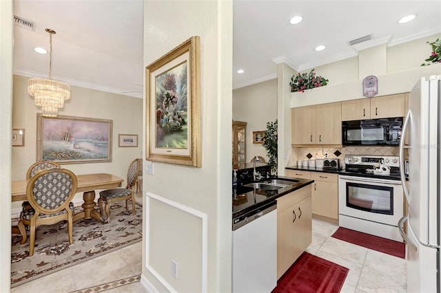 kitchen with white fridge, electric range, tasteful backsplash, dishwasher, and sink