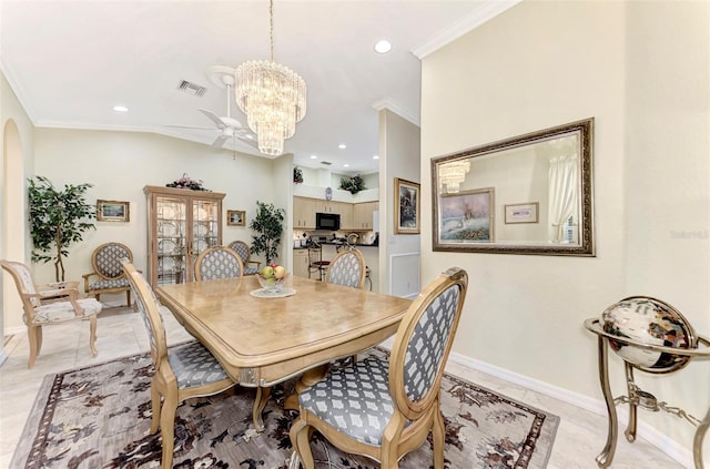 tiled dining space with crown molding and ceiling fan with notable chandelier