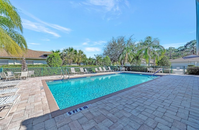 view of pool featuring a patio