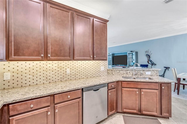 kitchen with stainless steel dishwasher, light stone countertops, and light tile floors