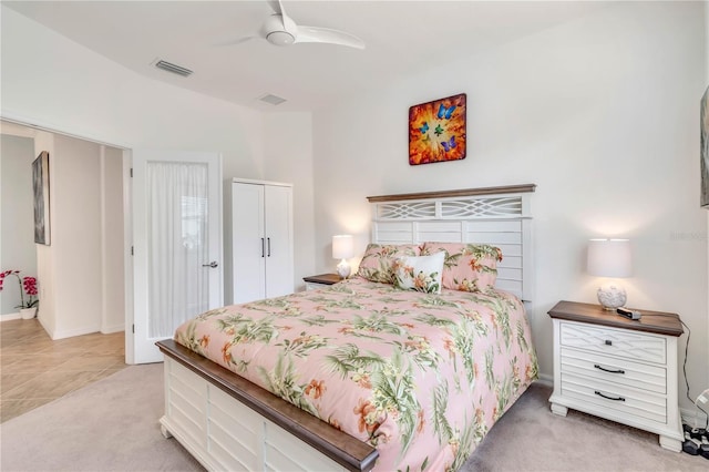 bedroom featuring ceiling fan and light colored carpet