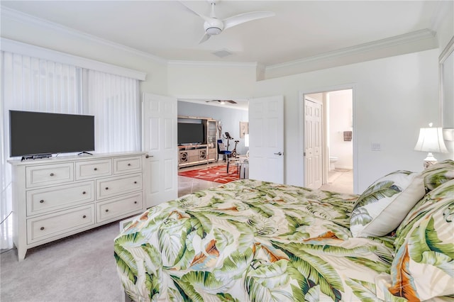 carpeted bedroom with crown molding, ceiling fan, and ensuite bathroom