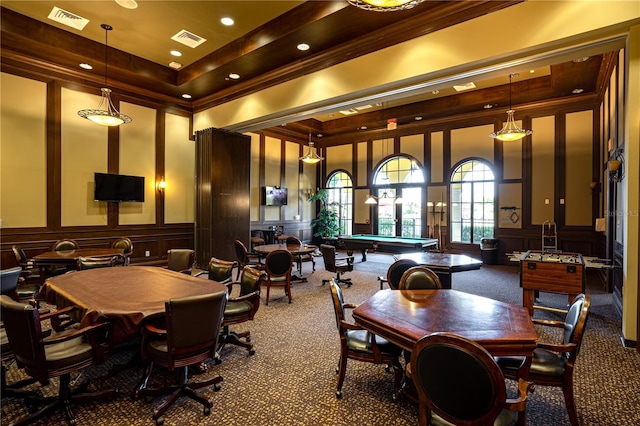 dining area featuring a tray ceiling, dark colored carpet, pool table, and a towering ceiling