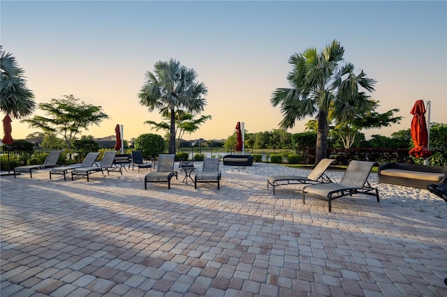 view of patio terrace at dusk