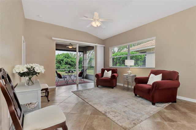 sitting room featuring vaulted ceiling, ceiling fan, and light tile floors