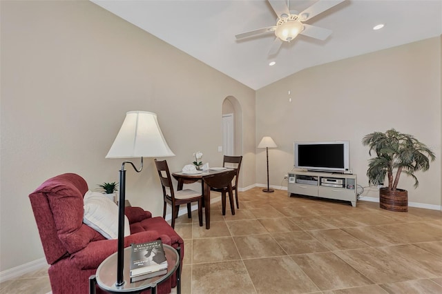 living area with light tile floors, lofted ceiling, and ceiling fan