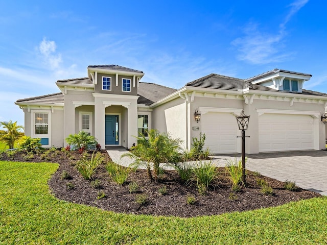 mediterranean / spanish-style home with a garage