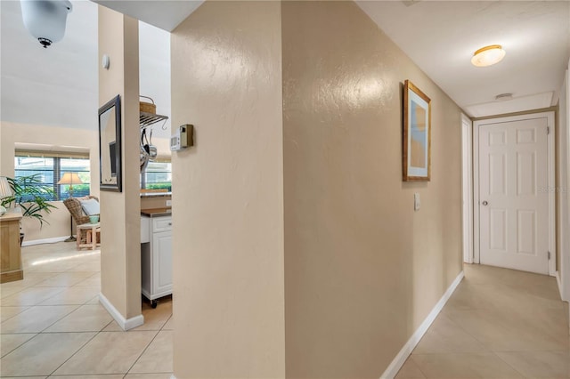 corridor with light tile floors