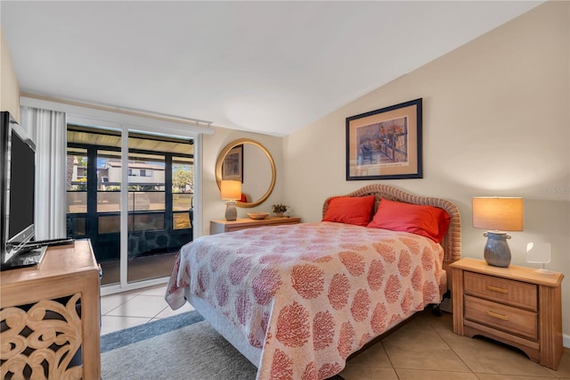 tiled bedroom with access to exterior and lofted ceiling