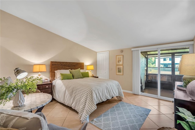 bedroom featuring access to exterior, a closet, and light tile floors