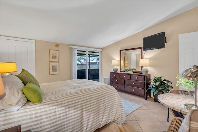 tiled bedroom featuring vaulted ceiling and access to outside