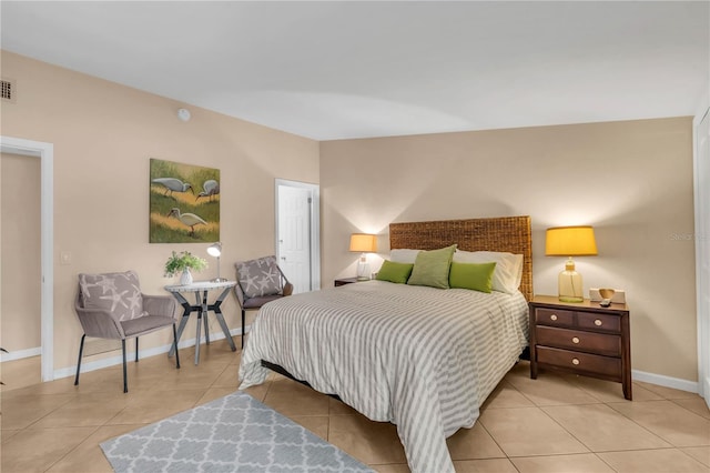 bedroom with light tile flooring