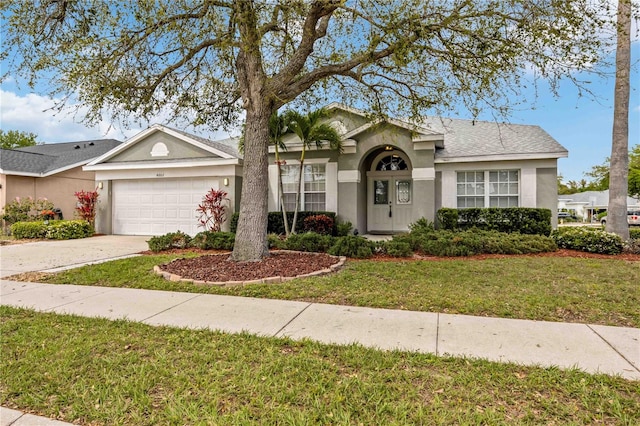 ranch-style house with a front lawn and a garage