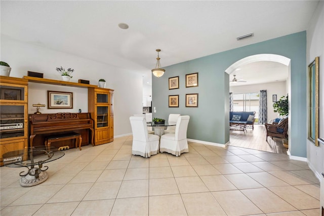 dining room featuring light tile flooring and ceiling fan