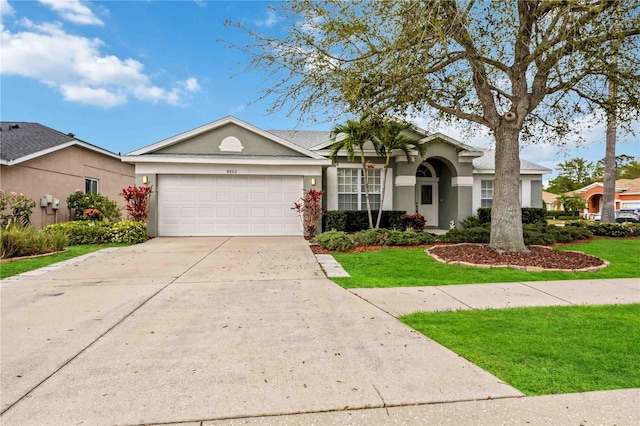 ranch-style house with a front lawn and a garage