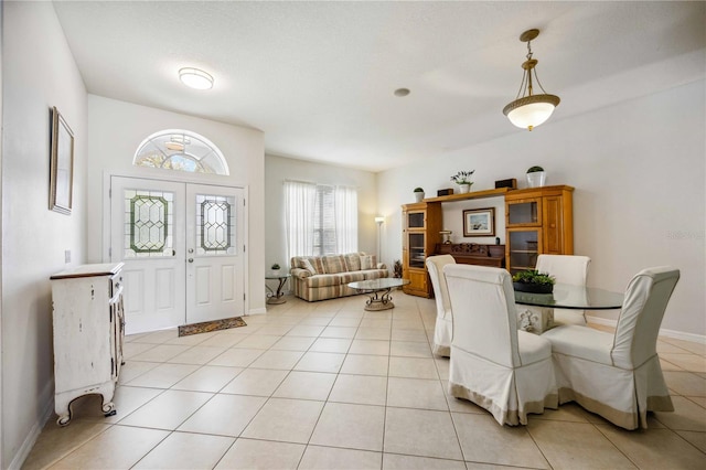 dining room featuring light tile floors