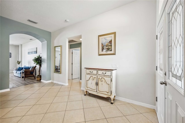 foyer featuring light tile flooring