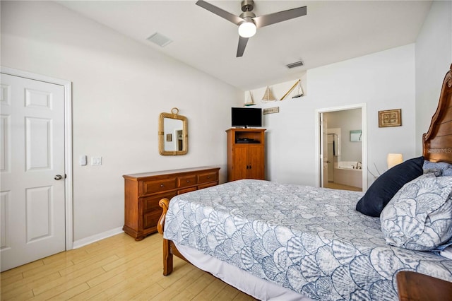 bedroom with lofted ceiling, ceiling fan, ensuite bathroom, and light hardwood / wood-style flooring