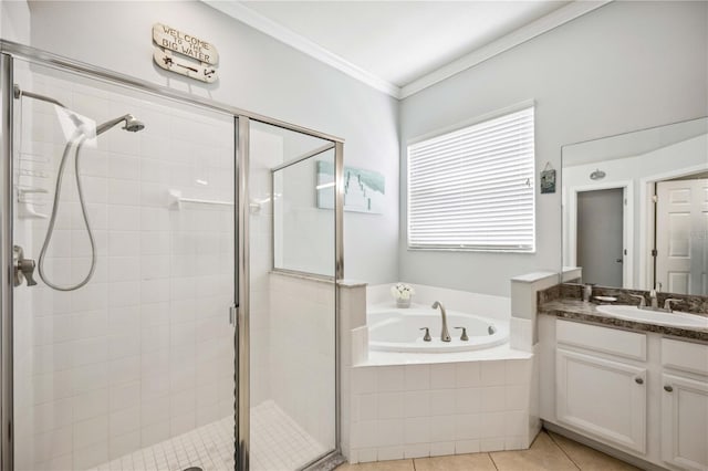 bathroom with shower with separate bathtub, vanity with extensive cabinet space, ornamental molding, and tile floors