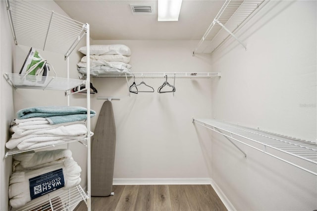 spacious closet with wood-type flooring