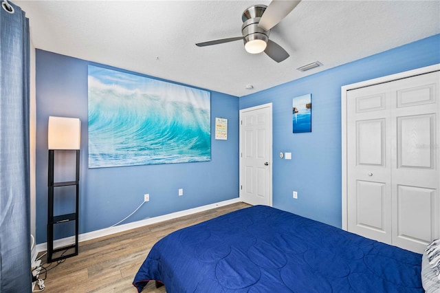 bedroom featuring dark hardwood / wood-style floors and ceiling fan