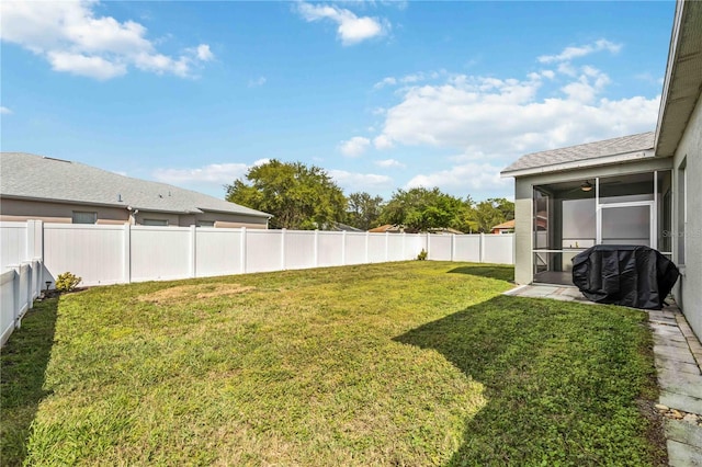 view of yard featuring a sunroom