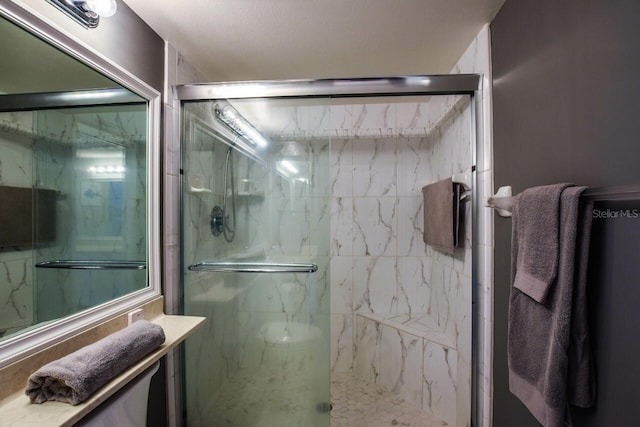 bathroom featuring vanity and a shower with shower door