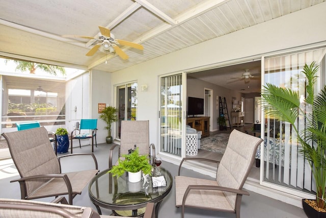 sunroom / solarium with ceiling fan