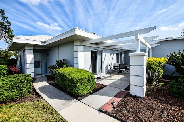 exterior space with a pergola and a patio area