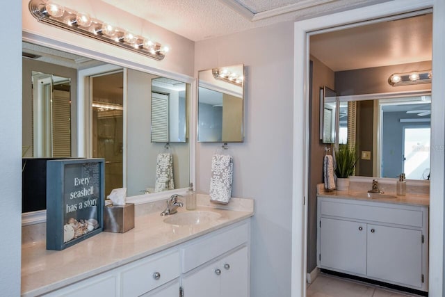 bathroom featuring vanity and a textured ceiling