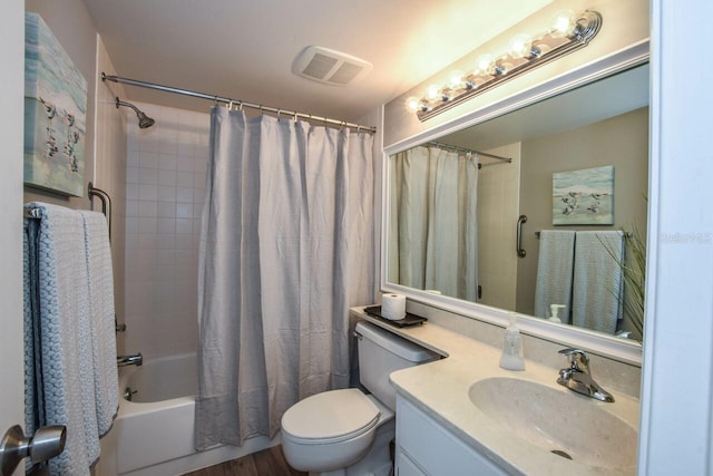 full bathroom featuring vanity, shower / bath combination with curtain, and toilet