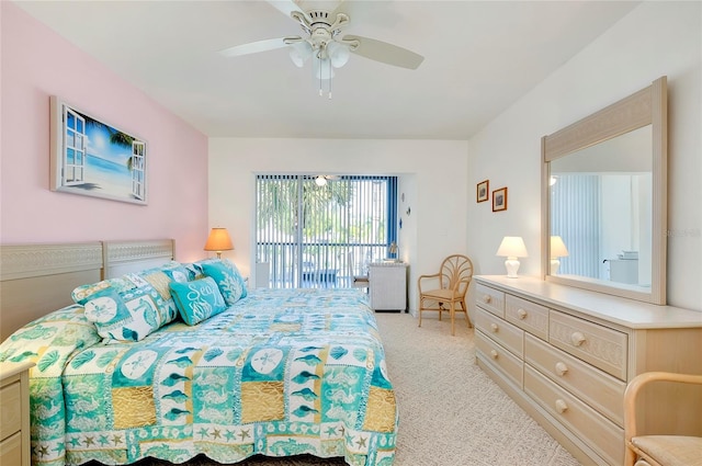 bedroom featuring access to exterior, light colored carpet, and ceiling fan