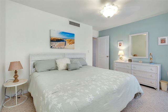 bedroom with light colored carpet