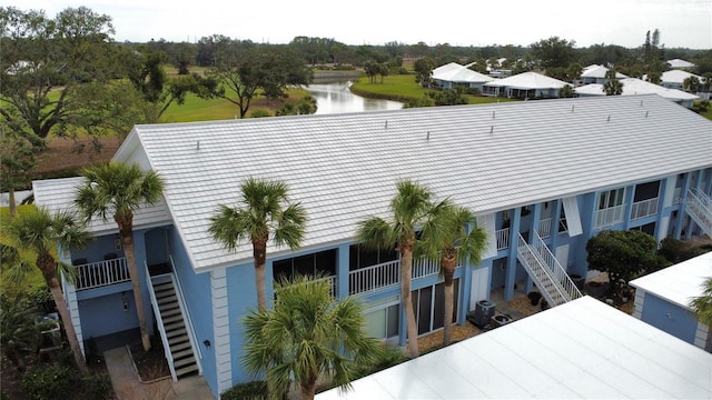 exterior space featuring a water view and central AC unit