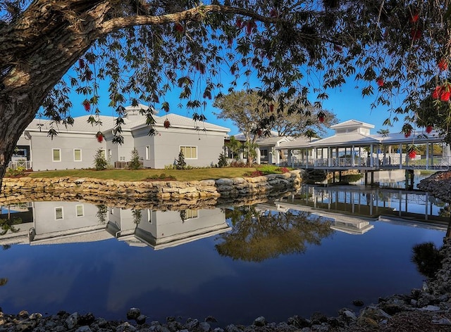 back of property with a water view