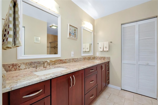 bathroom with double vanity, a closet, and a sink