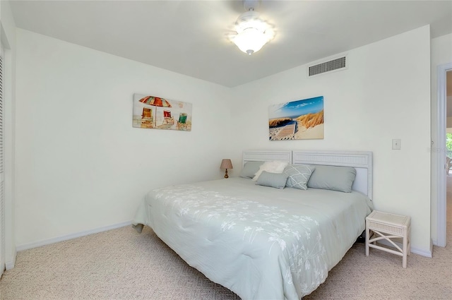 bedroom featuring light carpet, baseboards, and visible vents