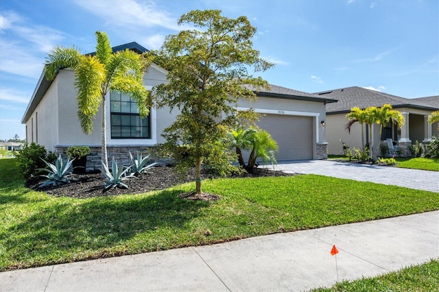 view of front of property with a garage and a front yard