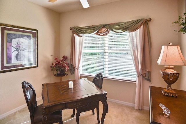 office area with ceiling fan and light carpet