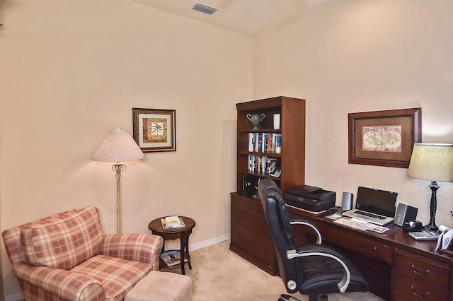 office area featuring light carpet