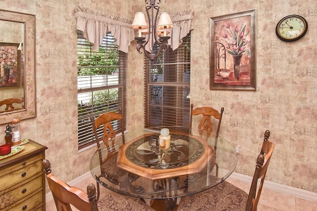 dining area featuring light tile floors and an inviting chandelier