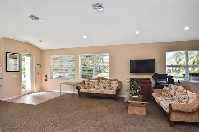 living room featuring lofted ceiling and dark carpet