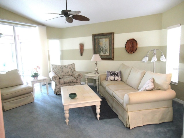 carpeted living room featuring vaulted ceiling, ceiling fan, and a wealth of natural light