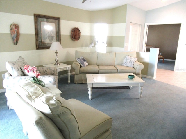 carpeted living room featuring vaulted ceiling