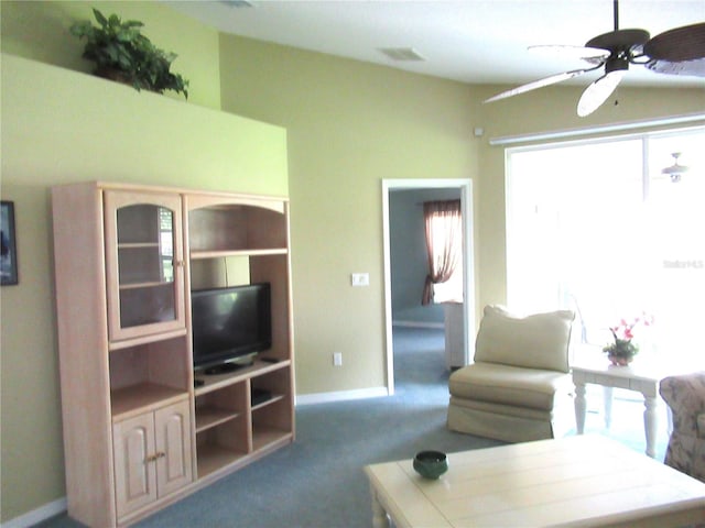 carpeted living room featuring ceiling fan