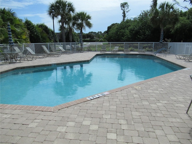 view of swimming pool featuring a patio area