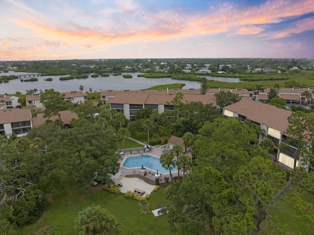 aerial view at dusk with a water view