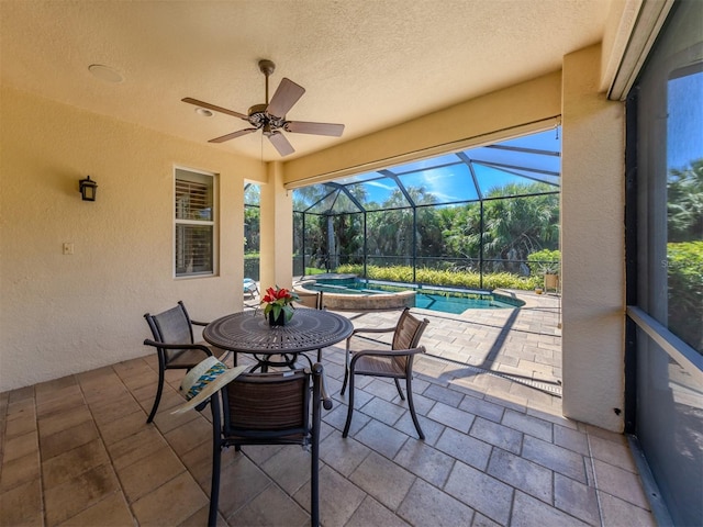 sunroom / solarium featuring ceiling fan