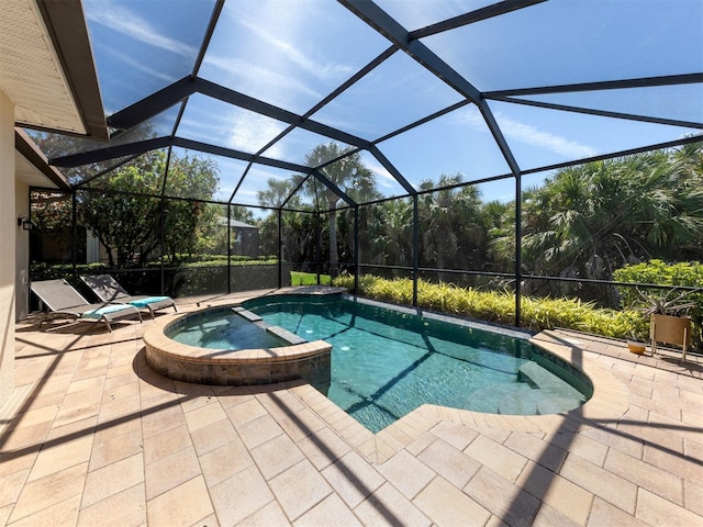 view of swimming pool with a patio area, an in ground hot tub, and glass enclosure